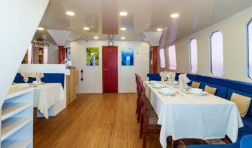 Danubio dining Interior of the Danubio Azul Yacht