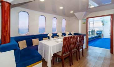 Danubio Ship dining and windows Dining area with wooden benches