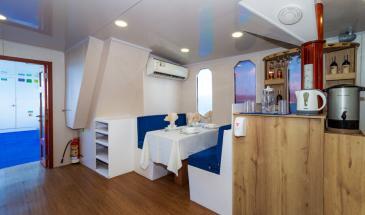 Danubio yacht dining second area Bar Area and small dining area of Danubio Galapagos Yacht