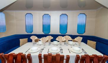 Table food window table food Interior dining area of the Yacht Danubio Azul