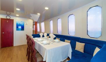 Danubio food table Dining area and windows of the Yacht Danubio